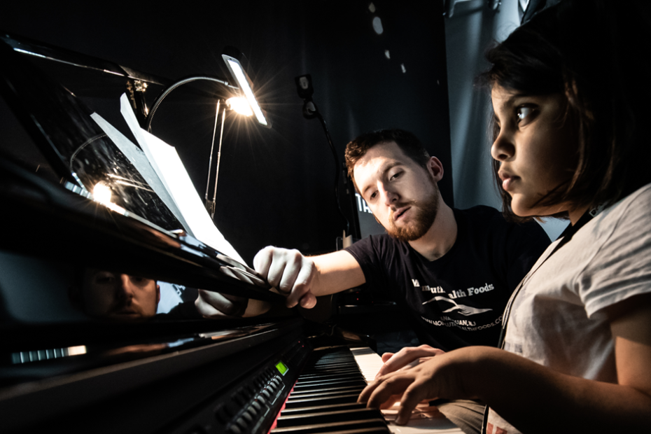 A child learns piano.